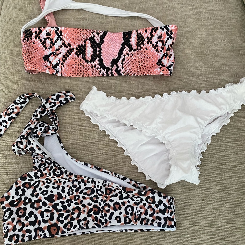 Two one shoulder tops, one bottom and one piece